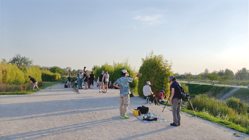 4 - A group of people gathered along a wide dirt path awaiting the solar eclipse astronomical event in Spain in 2026